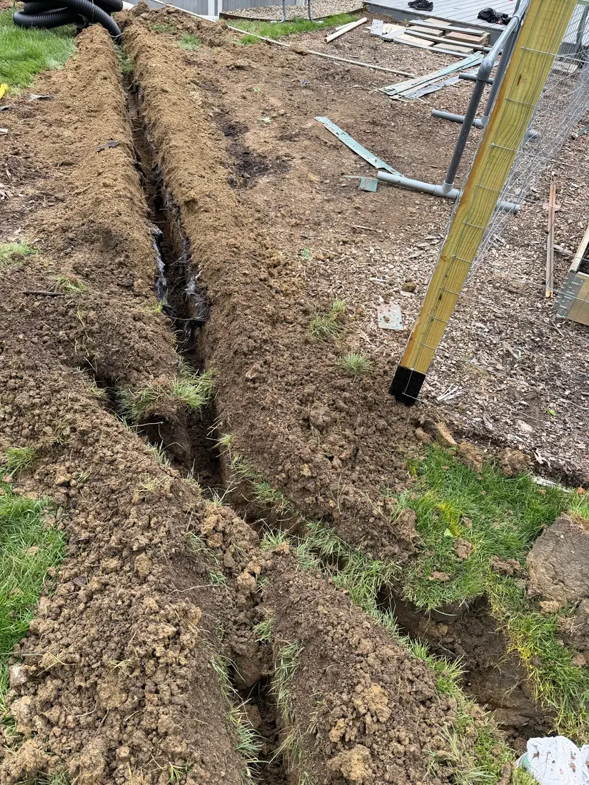 French drain trench dug and ready for pipe