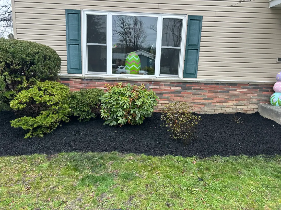 Mulched beds along the front of a home