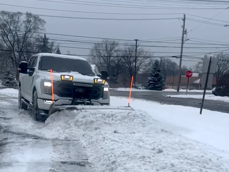 Our F-150 plowing a snowbank along a neighborhood road